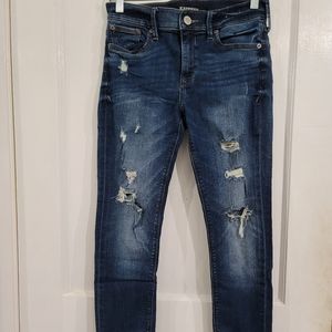 Stretch Mid Rise Ripped Legging Jeans